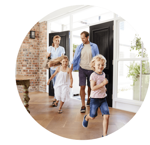 Family walking through front door to healthier indoor air quality thanks to a visit from Pacific Breeze Air Systems.